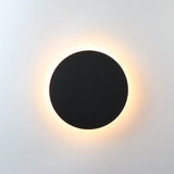 Applique murale moderne LED ronde noire, lampe murale design pour éclairage intérieur contemporain.