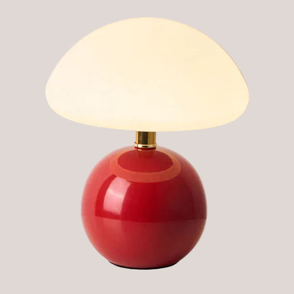 Lampe champignon design rouge avec abat-jour arrondi, lumière LED idéale pour décoration intérieure.